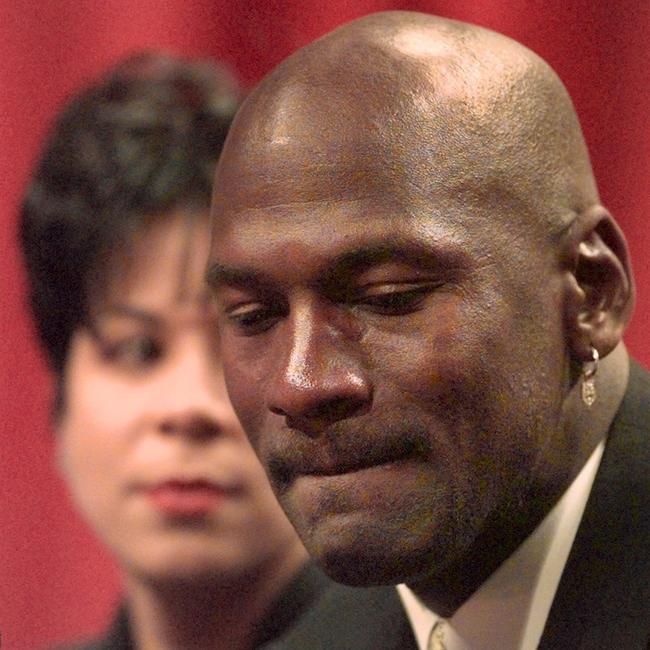 Michael Jordan in 1999 announcing his retirement as his wife Juanita looks on. Picture: AP