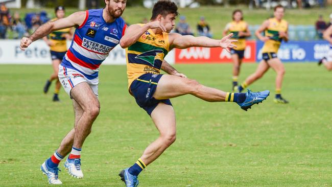 Woodville-West Torrens’ Riley Knight breaks clear of Central District’s Fraser Fort at Elizabeth Oval. Picture: Brenton Edwards.