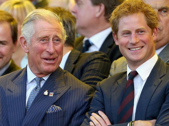 LONDON, ENGLAND - SEPTEMBER 10:  Prince Charles, Prince of Wales and Prince Harry laugh during the Invictus Games Opening Ceremony on September 10, 2014 in London, England. The International sports event for 'wounded warriors', presented by Jaguar Land Rover, is just days away with limited last-minute tickets available at www.invictusgames.org  (Photo by Chris Jackson/Getty Images)