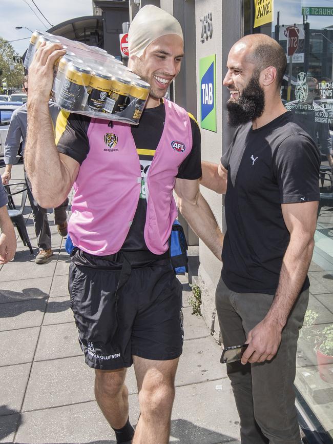 Alex Rance hams it up on ‘Tiger Tuesday’ with teammate Bachar Houli. Picture: Jason Edwards