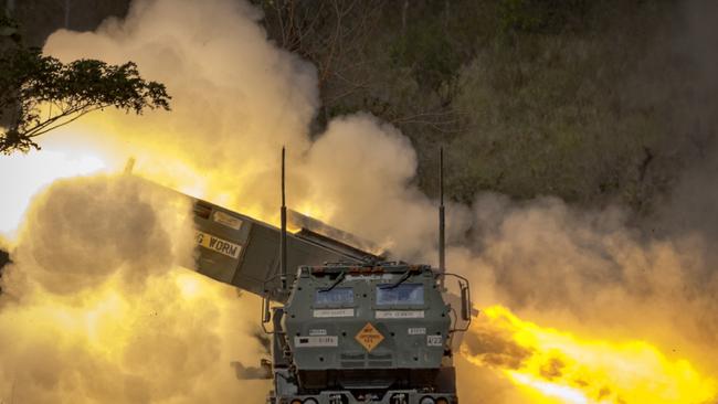 US and Philippine troops fire a High Mobility Artillery Rocket System (HIMARS) during live fire exercises in Laur in March. Australia’s surface-to-surface PrSMs can be fired from the US-made HIMARS launchers. Picture: Getty Images)