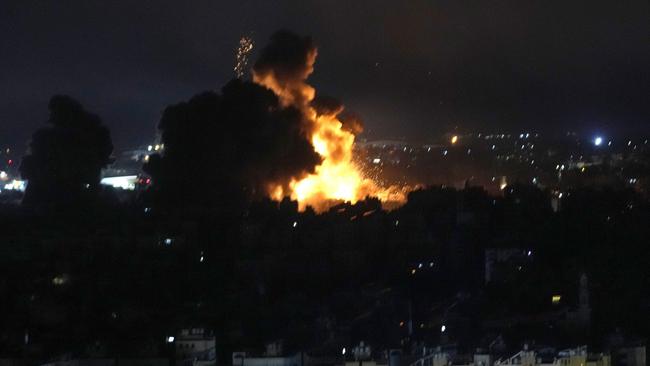 Flames rise from Israeli air strikes near Beirut airport. Picture: Hussein Malla