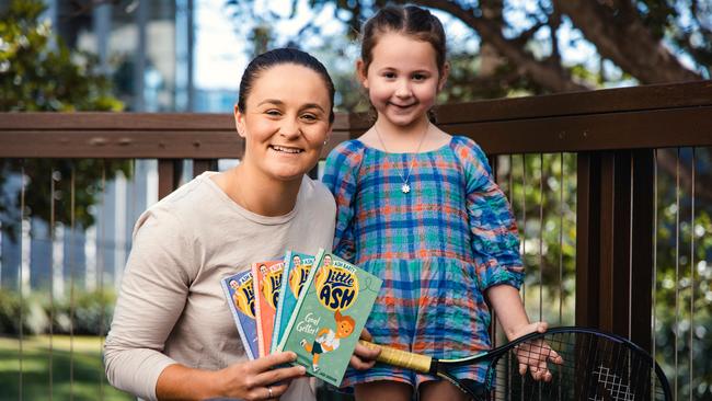 Ash Barty and her niece, Lucy, look at the retired tennis star’s new Little Ash children’s story books. Picture: Nic Morley