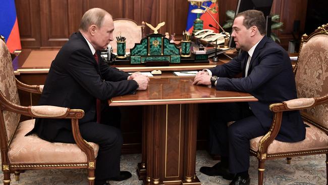 Vladimir Putin meets with Russian Prime Minister Dmitry Medvedev on the day the latter resigned. Picture: AFP