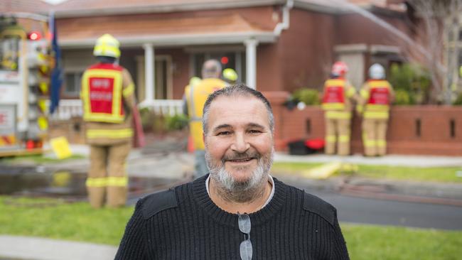 Domenic Chimirri, 53, pictured relieved in 2016 in front of the gutted house whose owner he rescued. Picture: Jason Edwards