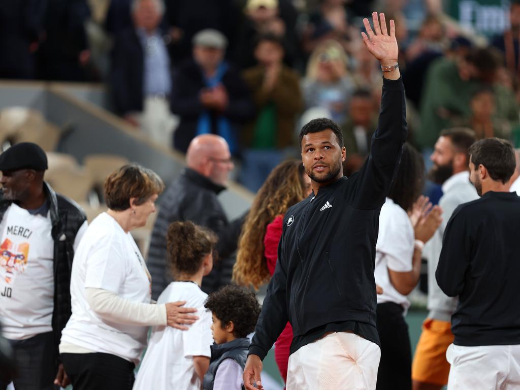 Jo-Wilfried Tsonga of France waves to the crowd during a presentation ceremony after his last match at Roland Garros. Picture: Clive Brunskill/Getty Images