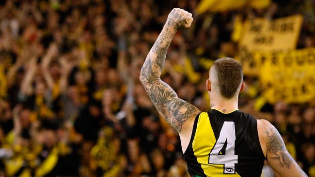 Dustin Martin salutes his adoring fans.