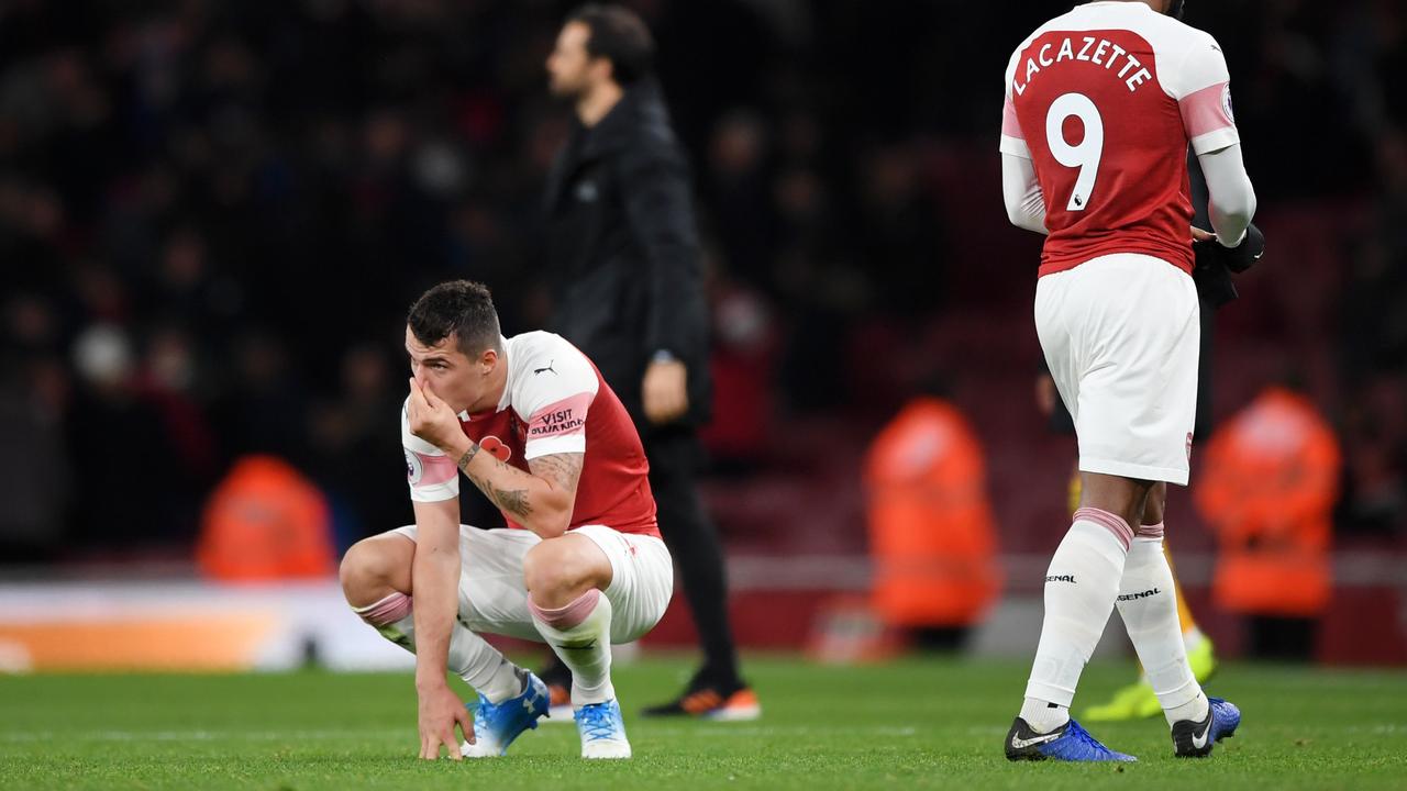 Granit Xhaka and Alexandre Lacazette of Arsenal react after full time