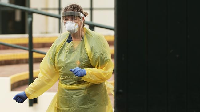 A medical worker is seen at a COVID-19 pop up testing clinic at Bondi Pavilion in April last year. (Photo by Mark Metcalfe/Getty Images)