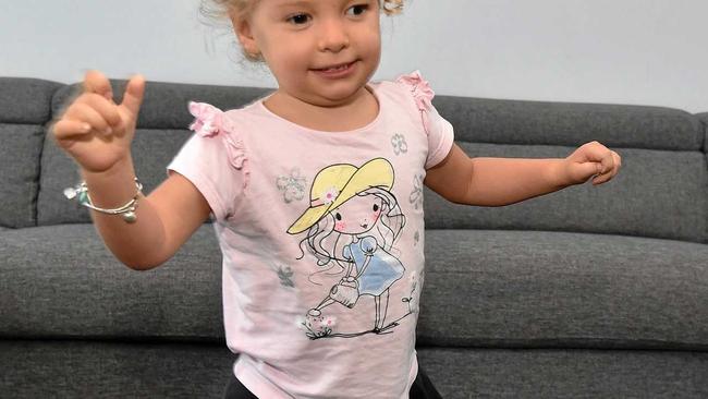 Three-year-old Keira has just taken her first steps. She was born with CMV and is deaf. Her parents were told she would never walk. Picture: Warren Lynam