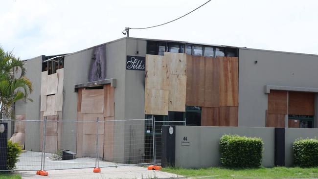 The boarded-up shell of Silks brothel at Bundall after fire destroyed the premises. Picture Glenn Hampson