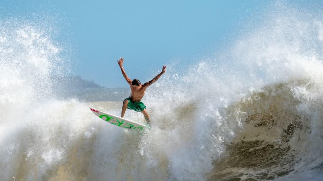 PHOTOS: Qld surfers take on huge cyclone swell