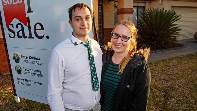 Ryan McCan, 24, and his partner Rhian Hill, 25, at their first home, which they've recently bought in Hoppers Crossing. They've been living with parents in Tarneit but will soon move into the house. It's for a "First-Home Buyers' Guide" set to run in the Sunday Herald Sun. Picture: Mark Stewart