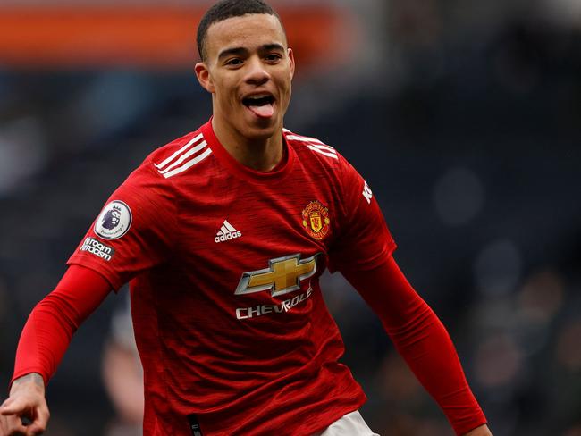 Manchester United's English striker Mason Greenwood reacts after scoring the team's third goal during the English Premier League football match between Tottenham Hotspur and Manchester United at Tottenham Hotspur Stadium in London, on April 11, 2021. (Photo by Adrian DENNIS / POOL / AFP) / RESTRICTED TO EDITORIAL USE. No use with unauthorized audio, video, data, fixture lists, club/league logos or 'live' services. Online in-match use limited to 120 images. An additional 40 images may be used in extra time. No video emulation. Social media in-match use limited to 120 images. An additional 40 images may be used in extra time. No use in betting publications, games or single club/league/player publications. /