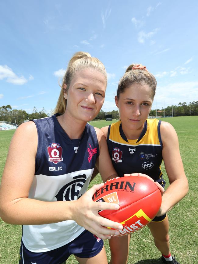 Womans QAFLW Players Erin Sundstrom of Bond Uni AFL team and Beth Pinchin of the Coolangatta AFL team (blue and white) . Pic Mike Batterham