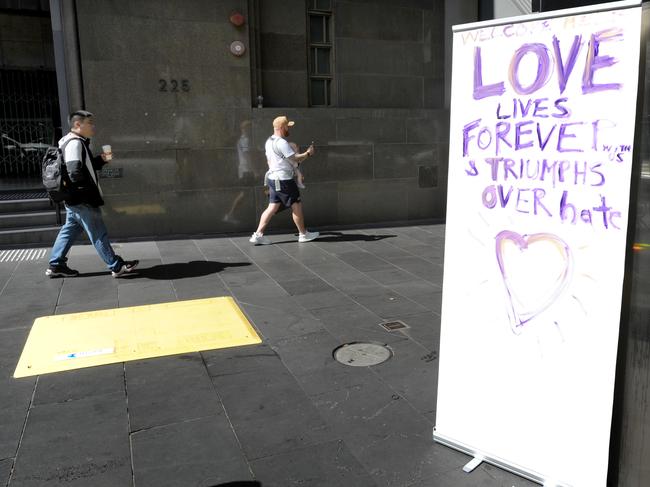 People pay their respects at the scene on Bourke Street after a terror attack earlier this month. Picture: Andrew Henshaw