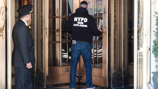 A policeman enters New York’s Sherry-Netherland hotel, where Guo Wengui has a penthouse apartment, on Wednesday. Picture: AFP