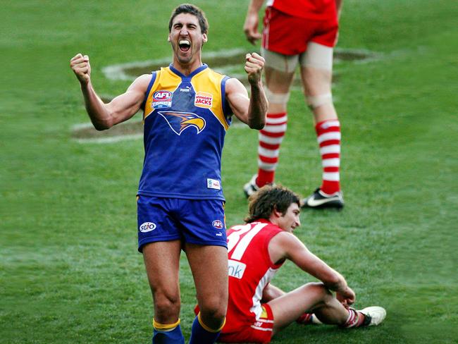 The former West Coast ruckman celebrates the Eagles’ 2006 grand final win with one of his now colleagues Brett Kirk in the background. Picture: Colleen Petch