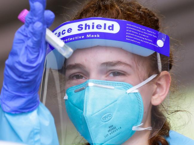 SYDNEY, AUSTRALIA - NewsWire Photos DECEMBER 28, 2020. A Nurse is seen working testing locals at the Warringah Aquatic Centre Pop-up Drive-through Covid-19 Testing site in Sydney Australia. Picture: NCA NewsWire / Gaye Gerard