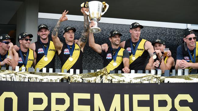 Tigers Dustin Martin, left, and Trent Cotchin hold the Premiership Trophy aloft on Sunday at the Gold Coast. The Richmond Tigers defeated the Geelong Cats in the AFL Grand Final on Saturday night. Picture: Getty Images