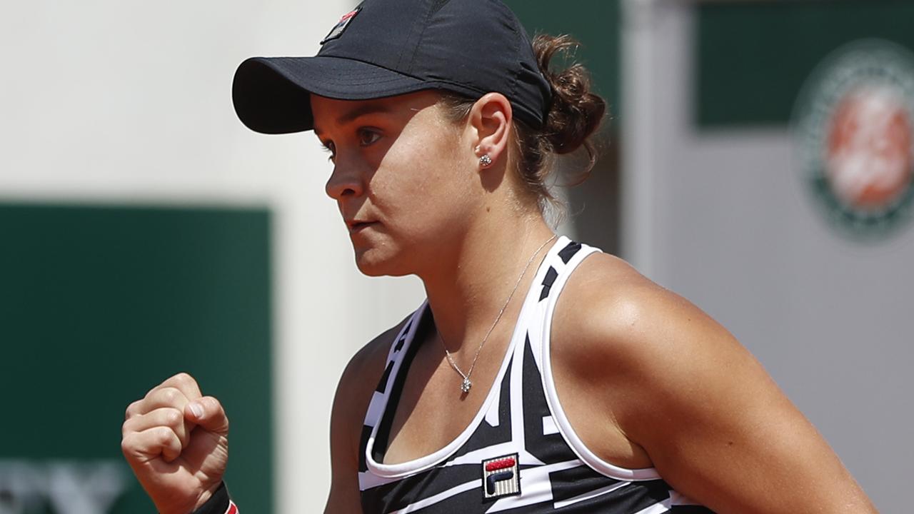 Asleigh Barty clenches her fist after winning a point against Madison Keys.