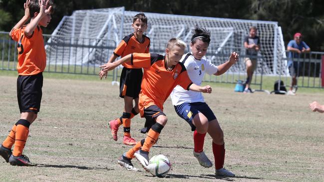 The Premier Invitational football tournament on the Gold Coast. Brisbane Roar Orange v TFC Brisbane White under-13s in action. Picture: Mike Batterham.