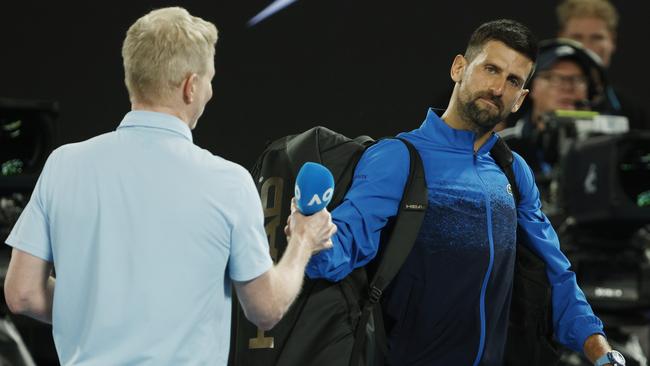 Novak Djokovic’s refusal to be interviewed by Channel 9 courtside presenter Jim Courier sparked an animated discussion with Australian Open tournament director Craig Tiley. Picture: Michael Klein