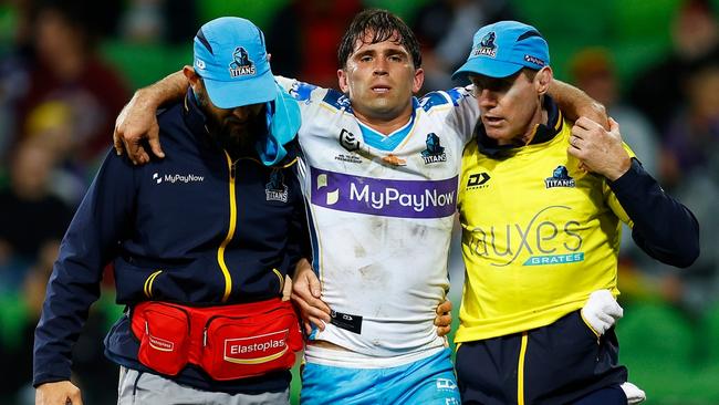 MELBOURNE, AUSTRALIA - AUGUST 05: Aaron Booth of the Titans leaves the field with trainers during the round 21 NRL match between the Melbourne Storm and the Gold Coast Titans at AAMI Park, on August 05, 2022, in Melbourne, Australia. (Photo by Daniel Pockett/Getty Images)