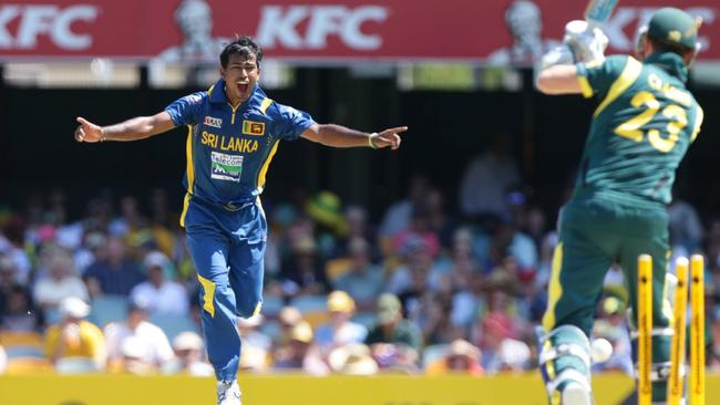 Nuwan Kulasekara bowls Australia’s Michael Clarke in a One Day International at the Gabba in Brisbane. Picture: Peter Wallis