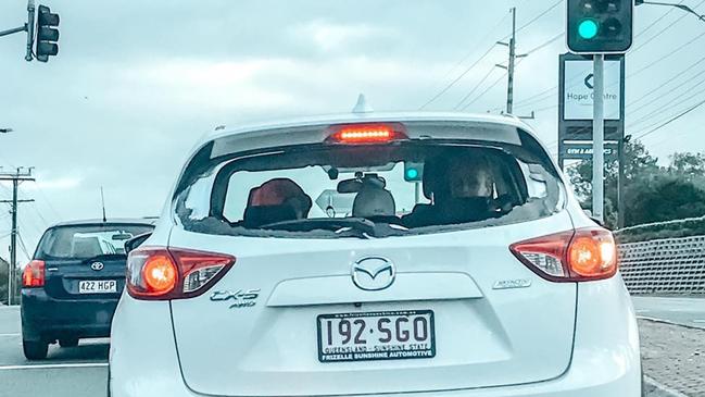 The stolen car with its smashed back window was later found at Mabel Park State School.