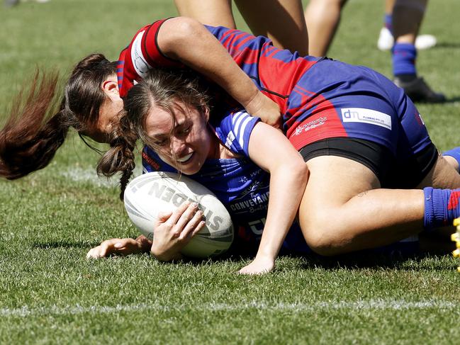 Narellan's Georgia Nies tackled by Collegians' Aggie Dean. Picture: John Appleyard