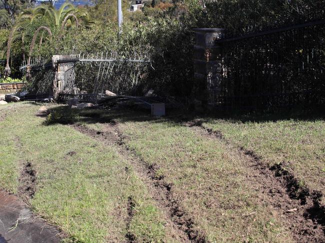 Tyre marks where the Holden Commodore, driven by a teenager who was well over the speed and alcohol limit, spun out of control and smashed through a sandstone fence at Elanora Heights. Picture: David Swift