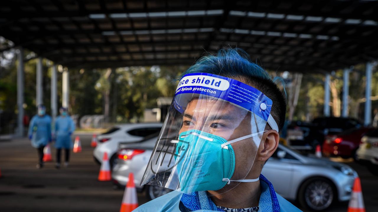 SYDNEY, AUSTRALIA - NewsWire Photos July 11, 2021: Covid testing and cars lined up at Fairfield covid drive through clinic. Picture: NCA NewsWire / Flavio Brancaleone