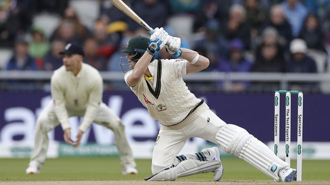 Steve Smith plays an unorthodox shot to reach his half-century. Picture: Getty