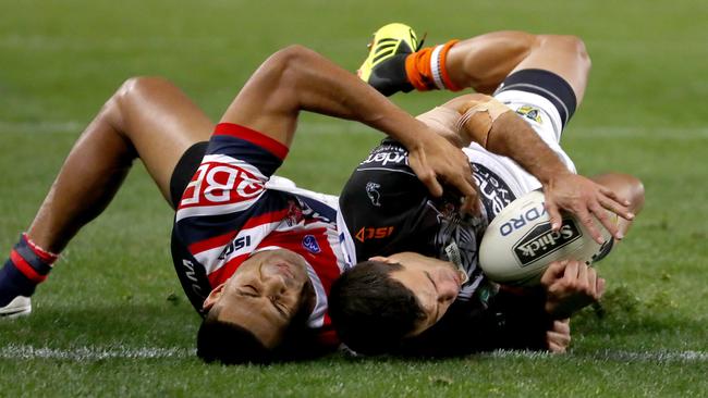 Daniel Tupou tackles Corey Thompson to avoid a decisive try.