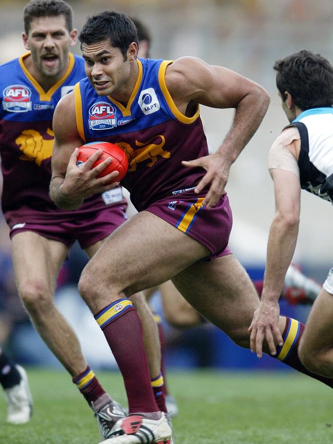 Mal Michael bursts from defence during the 2004 Grand Final.