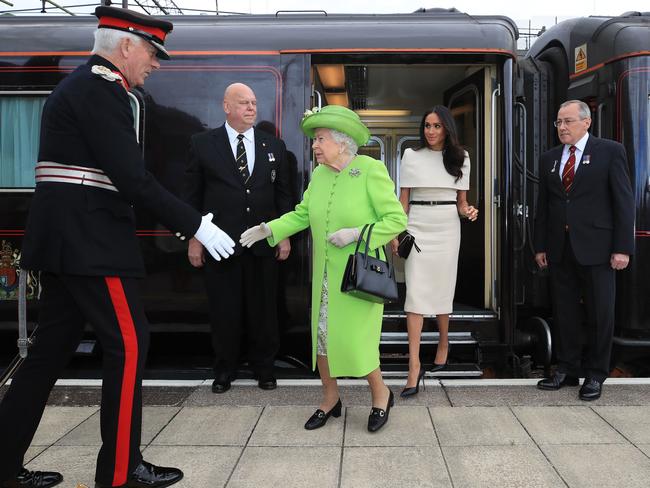 Britain's Queen Elizabeth II arrives with Meghan Markle, Duchess of Sussex by Royal Train at Runcorn Station to carry out engagements in Cheshire. Picture: AFP