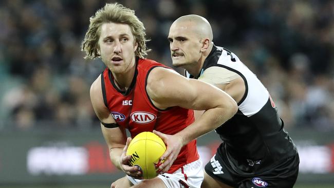 Dyson Heppell slips away from Sam Powell-Pepper. Picture: Sarah Reed