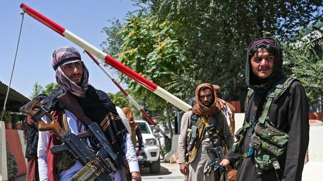 Taliban fighters stand guard along a roadside near the Zanbaq Square in Kabul. Picture: AFP