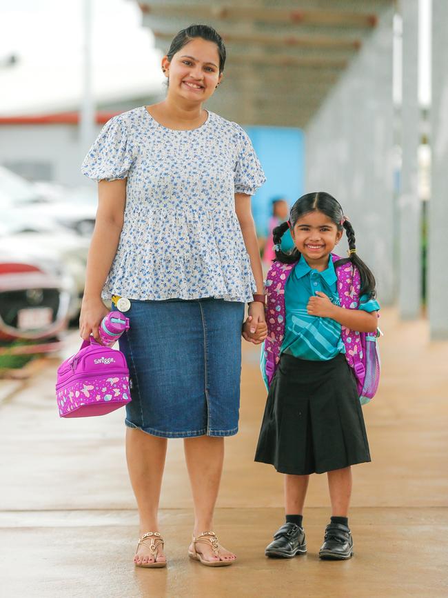 Struthy and Avannah Rosgit Menon on Avannah’s first day of school at Zuccoli Primary. Picture: GLENN CAMPBELL