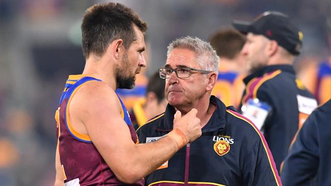 Luke Hodge and Lions coach Chris Fagan talk tactics at three quarter time against North Melbourne. Pic: AAP