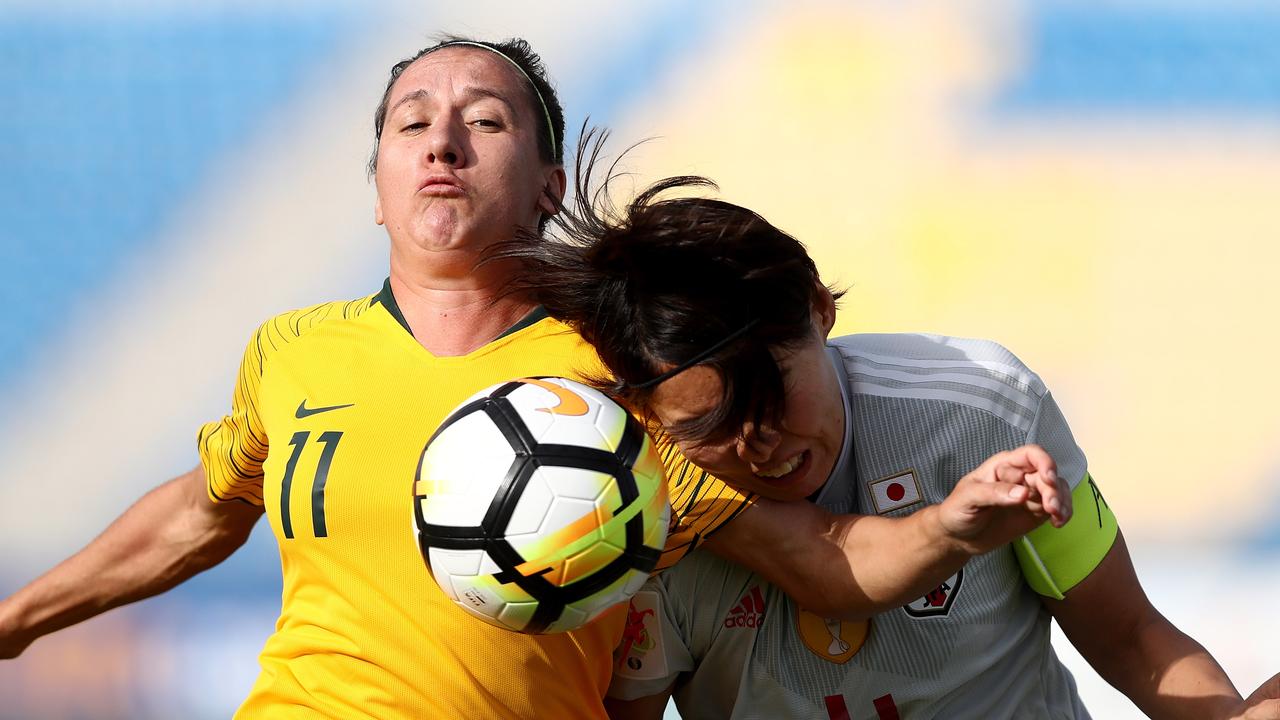 Saki Kumagai of Japan and Lisa De Vanna of Australia vie for the ball during the AFC Women's Asian Cup Group B match.