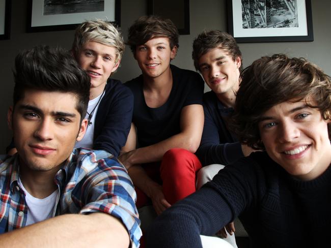 Band members (L-R) Zayn Malik, Niall Horan, Louis Tomlinson, Liam Payne and Harry Styles relax back at the Intercontinental Hotel, in exclusive access behind the scenes with British boy band 'One Direction' after they visited various media outlets in Sydney.