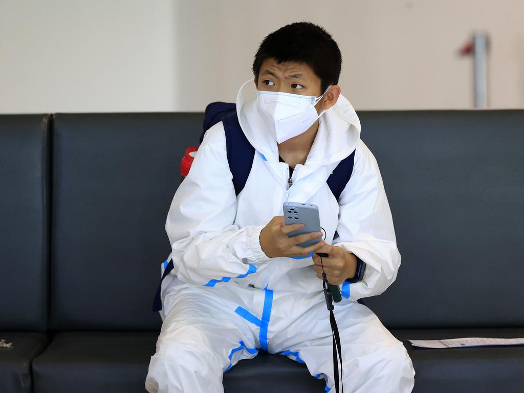 A man arrives at Brisbane International Airport on a flight from Singapore and waits in the home quarantine area to be picked up by family. Picture: Adam Head