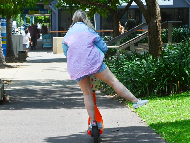 Escooter driver Kate Crozier (contact mobile 0428217900) riding through Darwin city Picture Julianne Osborne