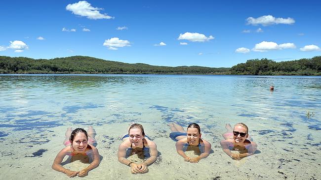 Tourists relax in the pristine waters of Lake McKenzie on Fraser Island. Picture: Alistair Brightman