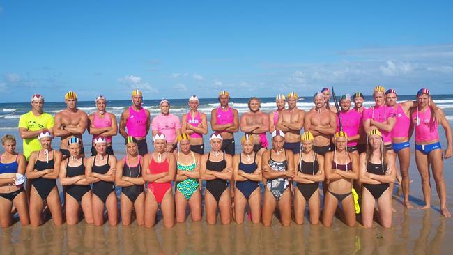 A group of surf life saving's leading athletes pose at Maroochydore in protest of Iron X. SUPPLIED.