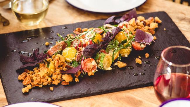 The conservatory’s Tuscan-inspired Panzanella salad, features local Bradsema heirloom tomatoes grown at Turners Beach, Westhaven feta and prosciutto, from the Best Butchery at Deloraine. Picture: MITCHELL BERWICK