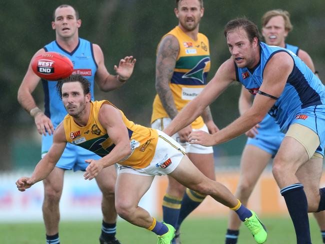 Eagles’ James Boyd gets a handball away against Sturt. Picture: STEPHEN LAFFER