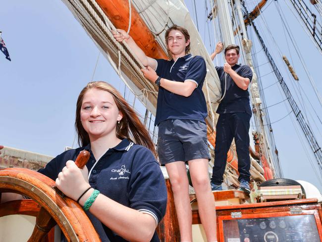 The One&All sailing ship will offer four young South Australians a cadetship, Thursday, January 9, 2020. Volunteers (L-R) Amber Finn, Stuart Mesecke and Aleks Cameron. (Photo: AAP/Brenton Edwards)